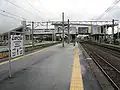 A view of the platforms and tracks showing how the station building spans the tracks.
