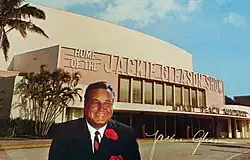 Autographed color photo of Gleason in front of Miami Beach Auditorium