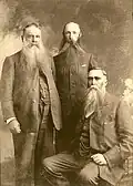 General Olivier is seated on the right.