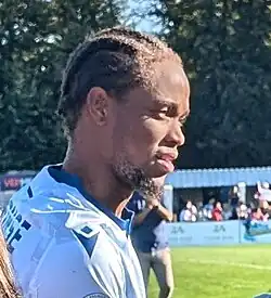 Right profile of the player squinting because of sunlight