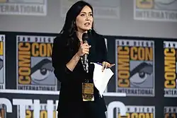 alt=Jessica Chobot speaking at the 2019 San Diego Comic Con International, for "The Eternals", at the San Diego Convention Center in San Diego, California. Please attribute to Gage Skidmore if used elsewhere.