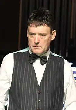 Jimmy White wearing a waistcoat and bow tie