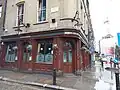 A wider image of the pub named after John Snow with the pump centre-right