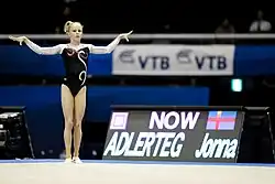 Jonna Adlerteg standing on the floor exercise