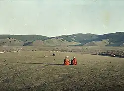 1913 photo of monks on Tasgan Hill facing the city to the south.