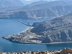 Khasab Harbor, with Atana Khasab Hotel in foreground and station for over-sea zipline
