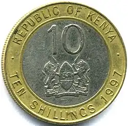 Face of coin showing figure 10 and the coat of arms of Kenya, surrounded by the words REPUBLIC OF KENYA, TEN SHILLINGS