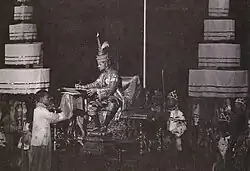 A 9-tiered umbrella beside the throne as King Prajadhipok signs a constitution in Ananta Samakhom Hall