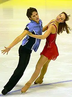 Parallel mirror spread eagles with the man on an inside edge and the woman on an outside edge