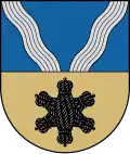 A coat of arms depicting a black, six-pointed star on a golden background on the bottom and grey swirls on a blue background on the top