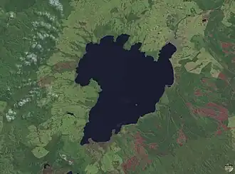 Image 19The scalloped bays indenting Lake Taupō's northern and western coasts are typical of large volcanic caldera margins. The caldera they surround was formed during the huge Oruanui eruption. (from Geography of New Zealand)