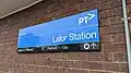 Station entrance signage, March 2023