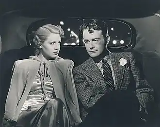 Woman and man seated in car