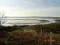 Looking west across the loch to the Rinns at low tide