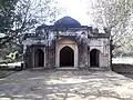 A mosque with the four walls of an enclosed garden behind