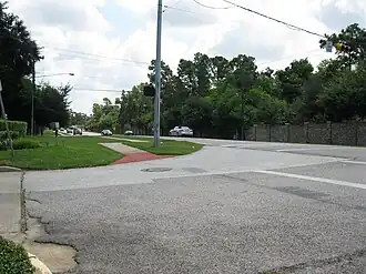 View is east on Memorial Drive at W. Forest. Approaching cars are on the downthrown side of the Long Point Fault.