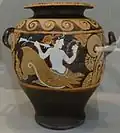 A monster with a woman's body (painted in white) and the heads of several dogs emerging from her groin.