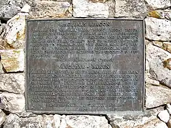 The plaque at Maclear's beacon at the highest point on Table Mountain (and the Cape Peninsula) at 1084&nbsp;m. It commemorates Maclear's recalculation of the curvature of the Earth in the Southern Hemisphere. In 1750, Abbé Nicolas Louis de Lacaille had measured the curvature of a meridian arc northwards from Cape Town, to determine the figure of the Earth, and found that the curvature of the Earth was less in southern latitudes than at corresponding northern ones (i.e. that the Earth was slightly pear-shaped, with the wider bulge south of the equator). However, when Sir George Everest visited the Cape in 1820 and inspected the site of La Caille's measurements in Cape Town, he suggested to Maclear that the gravitational effect of Table Mountain could have caused a miscalculation of the curvature of the meridian. This was based on Everest's experience in the Himalayas. Taking this factor into account Maclear established the curvature of the Southern Hemisphere was in fact the same as that of the Northern Hemisphere.