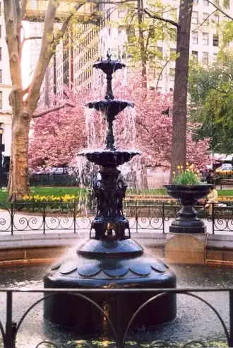 The fountain, a modern reproduction installed in 1990 based on the 1867 original, restored in 2015[27][28]