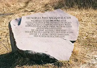 Image of the granite marker at Site A on a ground covered with snow