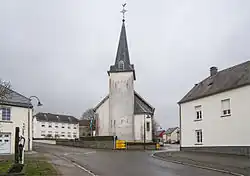 View of a church and surrounding buildings from the side of a street