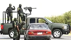 A Mexican Army Chevrolet Silverado equipped with a Mk&nbsp;19 at a military checkpoint in March 2009