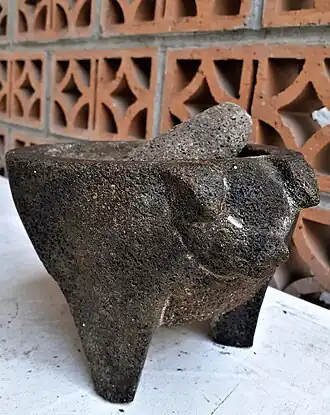 Molcajete with a pig head decoration, San Salvador el Seco, Puebla, México