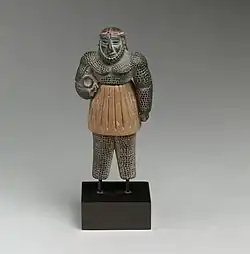Male figure; late 3rd–early 2nd millennium BC; chlorite, calcite, gold and iron; height: 10.1&nbsp;cm; Metropolitan Museum of Art