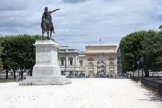 The statue of Louis XIV and the Arc de Triomphe.