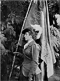 Annie Emmett with a flag, from Hillegas: With the Boers, 1900.