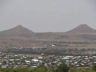 Image 11Hargeisa and much of northwestern Somalia is desert or hilly terrain. Here, the thelarchic-shaped Naasa Hablood hills are shown.