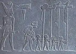 Narmer wearing the Deshret crown of Lower Egypt on the Narmer Palette