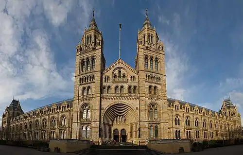 The Natural History Museum in London has an ornate terracotta facade typical of high Victorian architecture. The carvings represent the contents of the Museum.