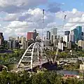 Cranes and nearly finished structure of new bridge with surroundings (September 7, 2016).
