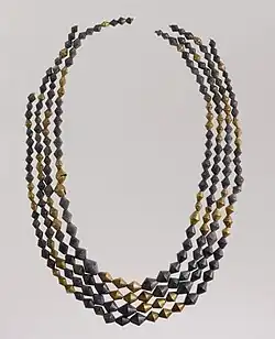 Sumerian necklace beads; 2600–2500 BC; gold and lapis lazuli; length: 54 centimetres (21&nbsp;in); Metropolitan Museum of Art