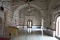Multi-cusped arches divide the interior into three bays