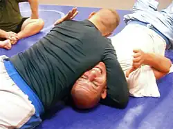 Grapplers demonstrate the North–south choke