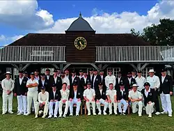 Old Tablelands and Brigands Team crickets line up in front of the pavilion for a Team Photo