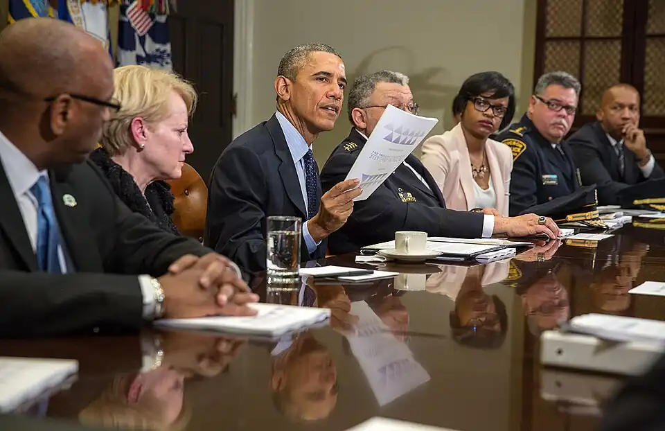 President Barack Obama and members of the President's Task Force on 21st Century Policing meet with the press on March 2, 2015, to discuss the interim report of the task force.
