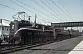 Pennsylvania Railroad GG1 number 4932 leads train 111 at South Amboy, NJ, on November 3, 1965