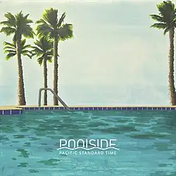 Silhouetted palm trees rise above the pool edge, with their fronds fanning out against the pale backdrop—evoking classic California warmth and leisure.