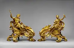 Pair of French Rococo andirons; circa 1750; gilt bronze; dimensions of the first: 52.7 × 48.3 × 26.7&nbsp;cm, of the second: 45.1 × 49.1 × 24.8&nbsp;cm; Metropolitan Museum of Art (New York City)