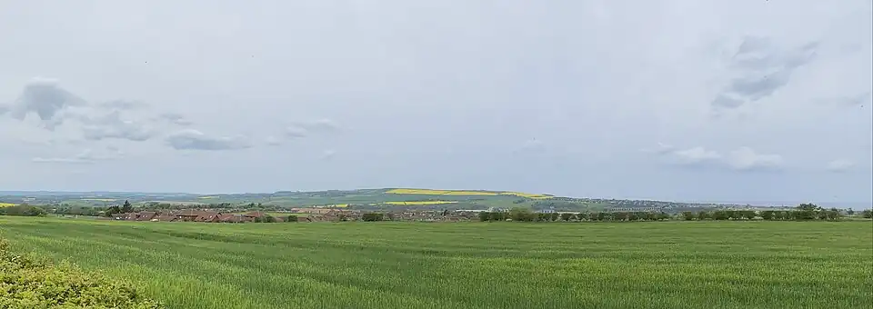 Panoramic view of Halidon Hill (centre) in 2023. The town of Berwick Upon Tweed is to east, on North Sea coast.