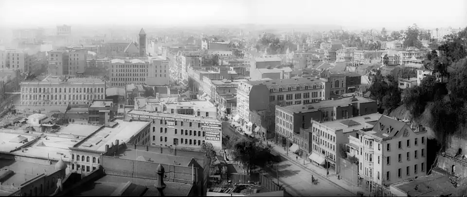 1905 view south on Broadway from Temple. Times Mirror printing house in foreground, marked 110 N. Broadway. The 1888 City Hall towers on Broadway's 200 block in the distance. Fort Moore Hill, now leveled, at right.