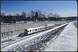 Rapid transit trains in a below-grade cut in an urban area