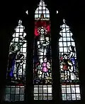 North window stained glass with modern-era children memorializes Rose Helena Wadden, said to have taught the first children's Sunday School class in Bridgwater