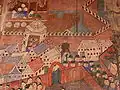 Murals at Wat Phumin showing the city and European troops