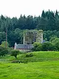 Penninghame Home Farm. View across fields to the south of the farm towards the remains of Castle Stewart