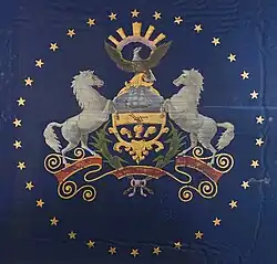 A Pennsylvania state flag from 1863, featuring a ring of stars around the coat of arms. It was made in November 1863 by a Philadelphia flag manufacturer for Governor Curtin's use during the Gettysburg National Cemetery's dedication on November 19, 1863.[30]