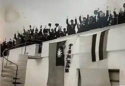 The flag used outdoors next to the flag of Manchukuo during a welcoming ceremony in Manchukuo.